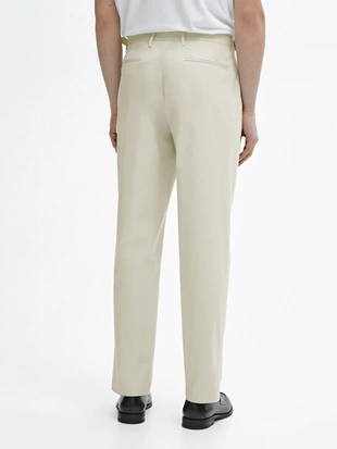 Брюки зауженного кроя с застежкой на пуговицы- Заказать в России