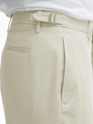 Брюки зауженного кроя с застежкой на пуговицы- Заказать в России