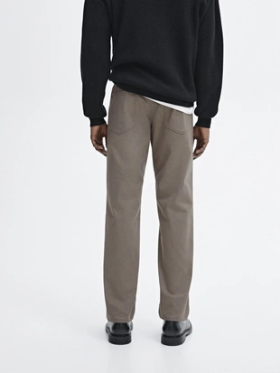 Джинсы зауженного кроя из хлопчатобумажной смеси- Заказать в России