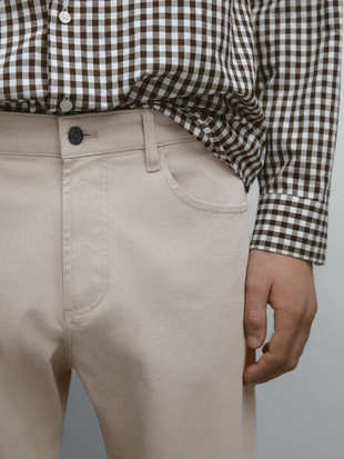 Джинсовые брюки зауженного кроя из хлопчатобумажной смеси- Заказать в России