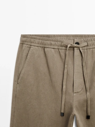 Брюки в стиле джоггер из хлопково-вискозного смесового материала- Заказать в России