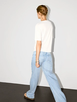 Широкая футболка с деталями люверсов- Заказать в России