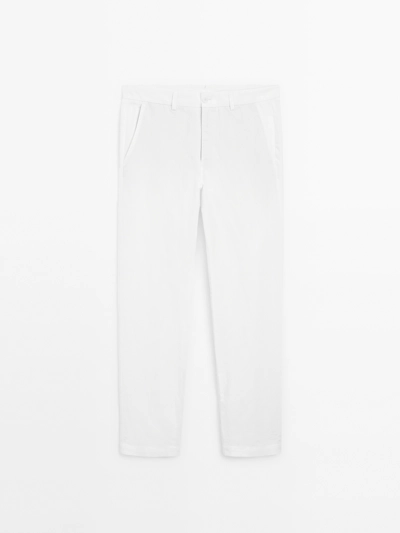 COTTON AND LINEN BLEND TAPERED FIT TROUSERS