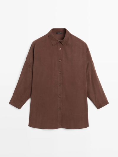 Длинная блузка с плавными линиями