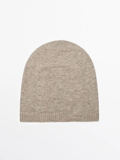 Шапка из тонкого вязаного полотна- Заказать в России