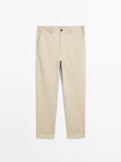 Брюки с зауженным кроем с эластичными вставками по бокам- Заказать в России