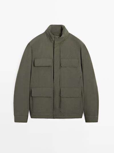 Пуховик с карманами и водоотталкивающей отделкой- Заказать в России