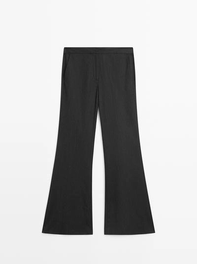 Брюки с зауженными штанинами в полоску- Заказать в России