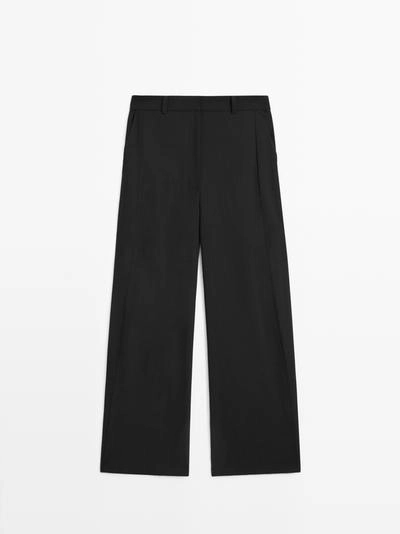 Брюки из шерстяной смеси с деталями шва- Заказать в России