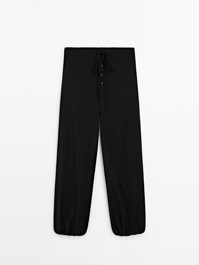 Massimo Dutti Шерстяные брюки саруэль с деталью завязки купить с доставкой.