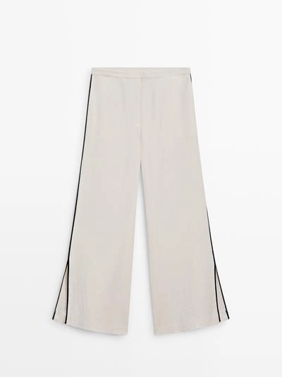 Брюки из льна с контрастной отделкой- Заказать в России