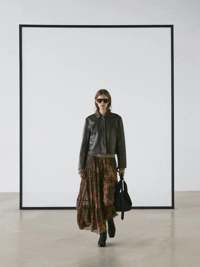 Плавная асимметричная юбка до середины икры- Заказать в России