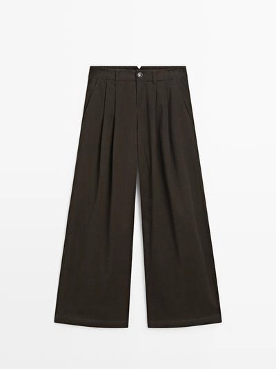 Брюки с широкими штанинами и защипами- Заказать в России