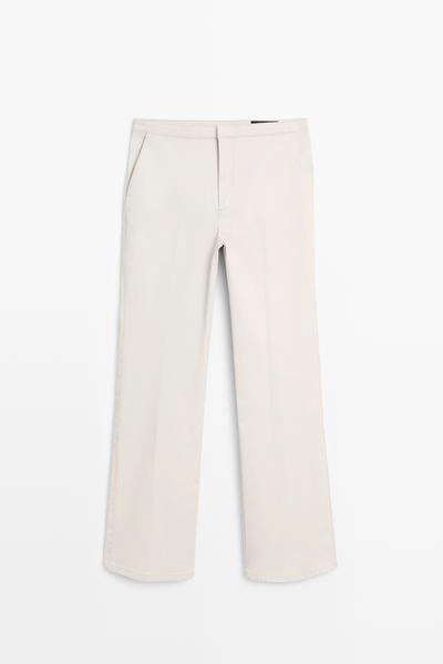 Брюки со средней посадкой и расклешенным кроем- Заказать в России