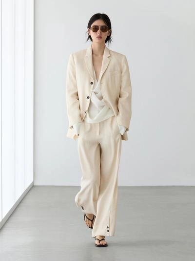 Брюки-костюм из льняной смеси с деталями на пуговицах- Заказать в России