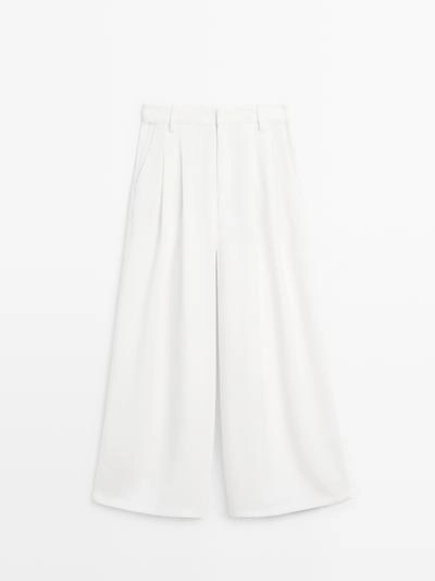 Широкие брюки с защипами- Заказать в России