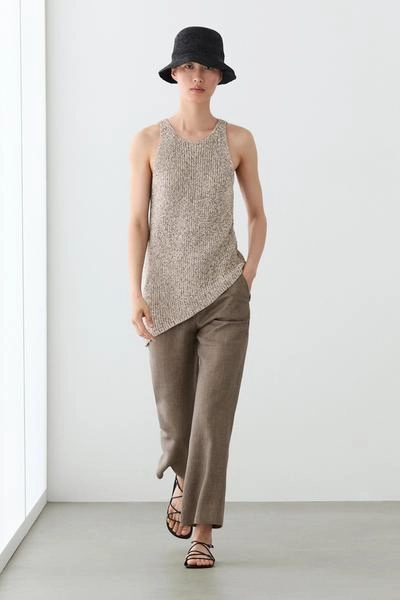 Брюки из льна с укороченным разрезом и зауженными штанинами- Заказать в России