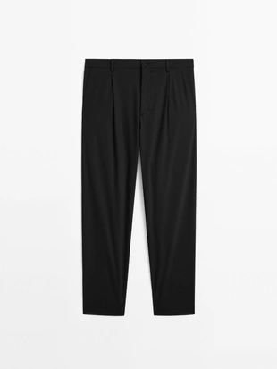 Брюки свободного кроя с деталями втачных складок- Заказать в России