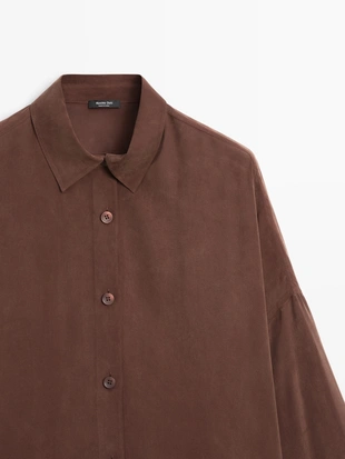 Длинная блузка с плавными линиями- Заказать в России