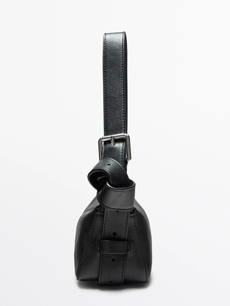 Сумка из натуральной кожи неплохого качества с пряжкой