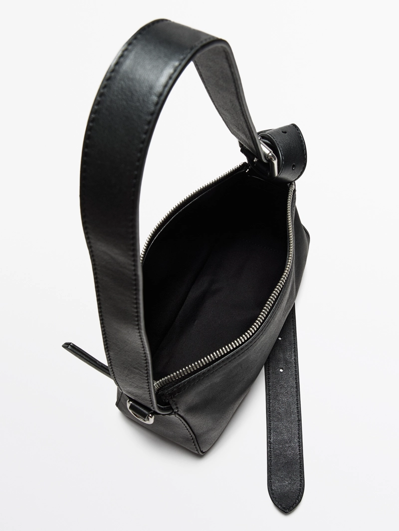 Сумка из натуральной кожи неплохого качества с пряжкой