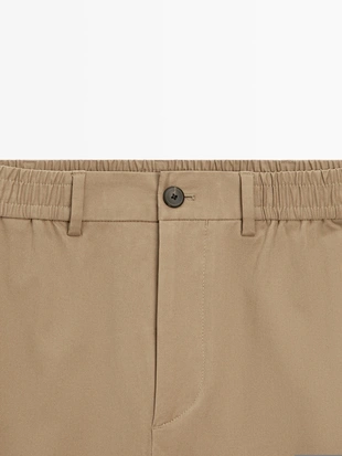 Хлопковые брюки в стиле джоггер из смесовой ткани- Заказать в России