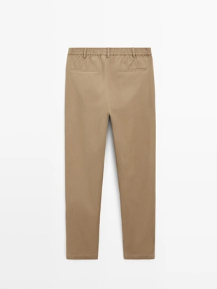 Хлопковые брюки в стиле джоггер из смесовой ткани- Заказать в России