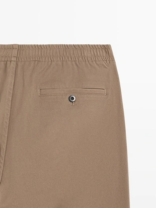 Хлопковые брюки в стиле джоггер из смесовой ткани- Заказать в России