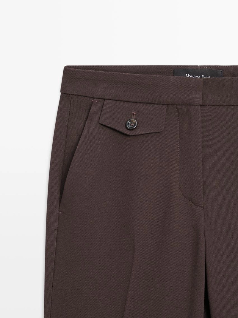 Брюки с карманами и расклешенным кроем