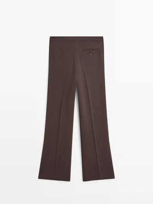 Брюки с карманами и расклешенным кроем- Заказать в России