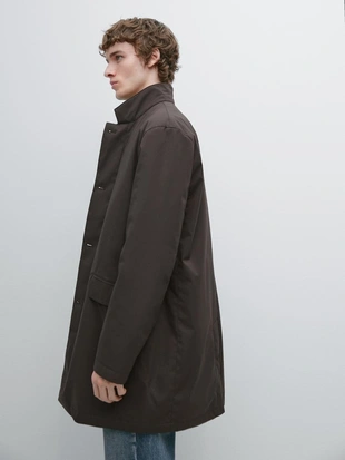 Полуприталенный пуховик с водоотталкивающей отделкой до середины бедра- Заказать в России