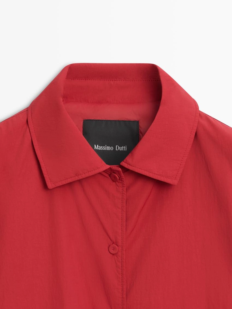 Короткий пуховик с карманом