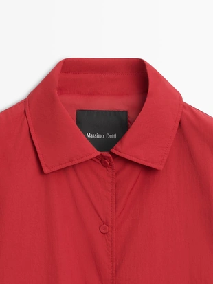 Короткий пуховик с карманом- Заказать в России