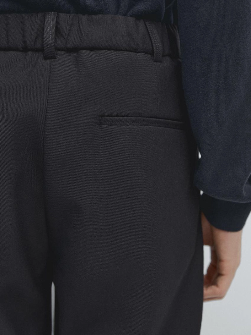 Брюки из шерстяной смеси свободного кроя с защипами