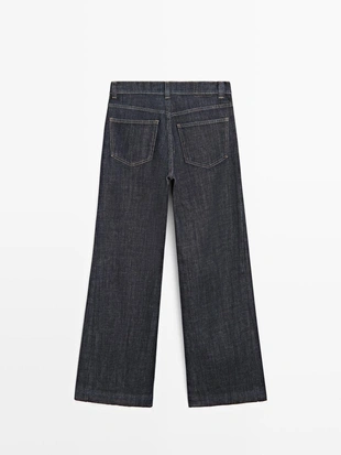 Джинсы с высокой талией и расширенными брючинами- Заказать в России