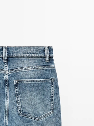 Джинсы с узкими брючинами и расклешенным подолом- Заказать в России