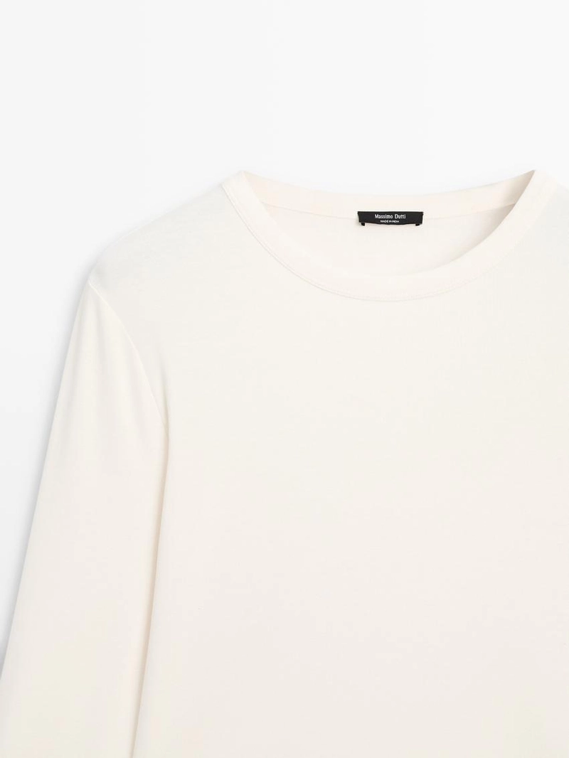 Футболка с длинным рукавом и закругленным подолом