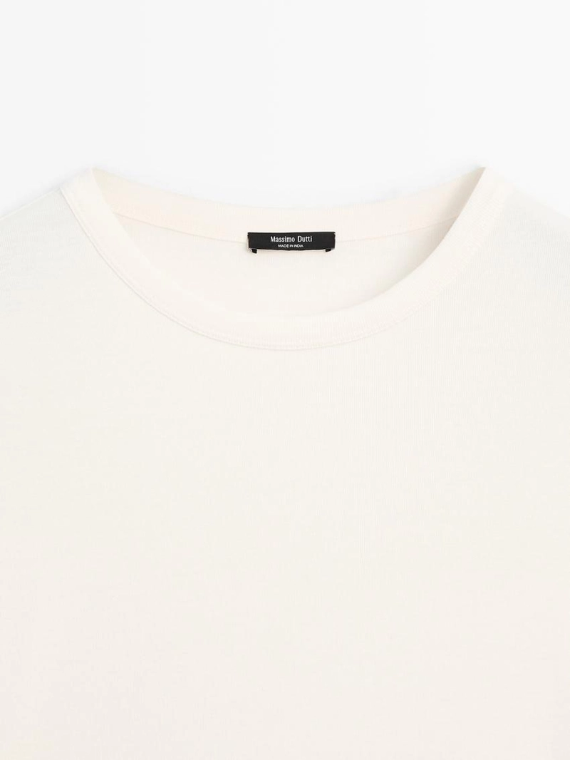 Футболка с длинным рукавом и закругленным подолом