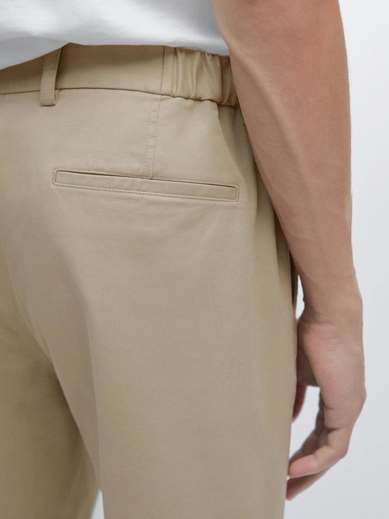 Брюки с зауженным кроем с эластичными вставками по бокам