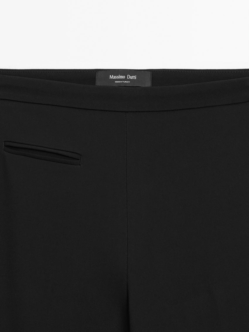 Брюки с расклешенными штанинами и карманом