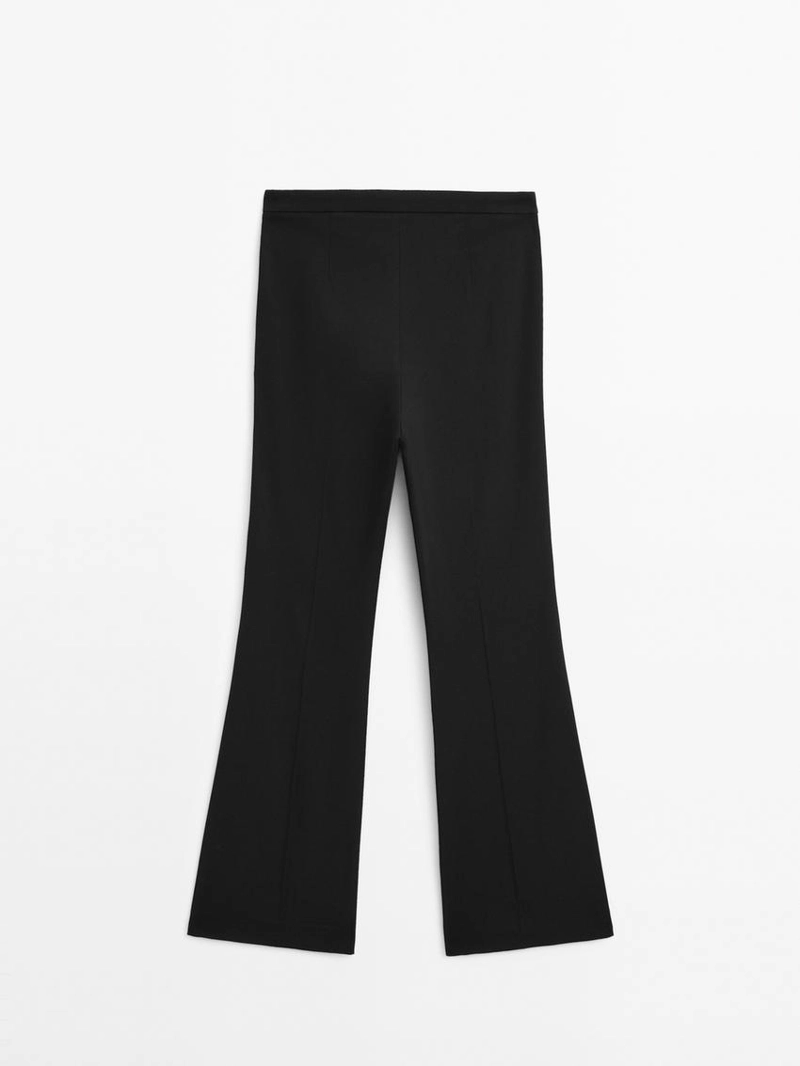 Брюки с расклешенными штанинами и карманом