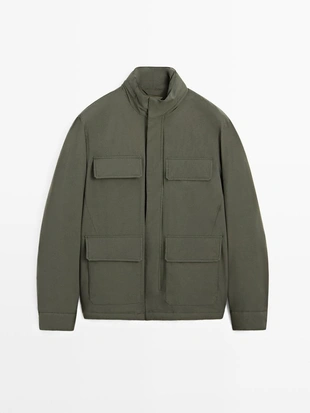 Пуховик с карманами и водоотталкивающей отделкой- Заказать в России