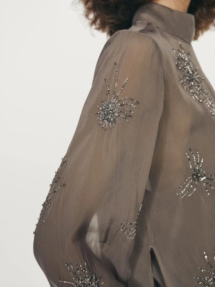 Блузка с вышивкой из полупрозрачной ткани- Заказать в России