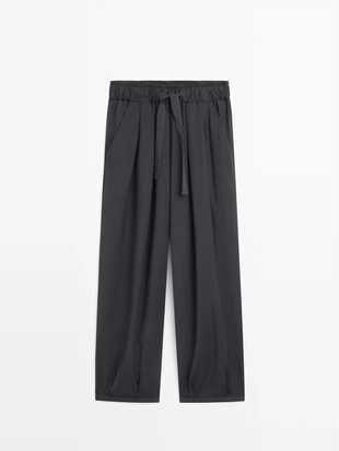 Широкие брюки с объемными складками- Заказать в России