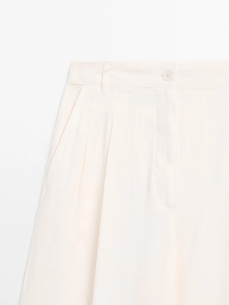 Брюки с широкими брючинами и двойными стрелками