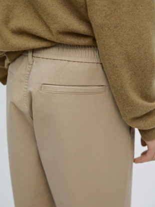 Хлопковые брюки с посадкой джоггер- Заказать в России