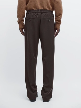 Брюки свободного кроя с защипами- Заказать в России