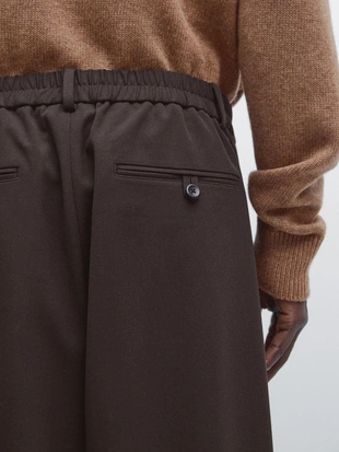 Брюки свободного кроя с защипами- Заказать в России