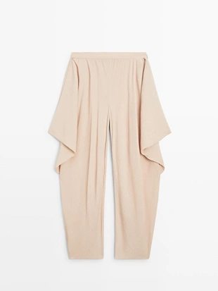 Потоковые объемные брюки- Заказать в России