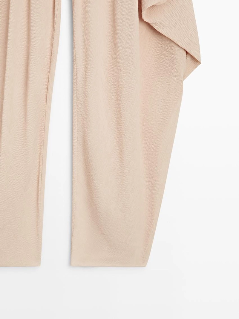 Потоковые объемные брюки